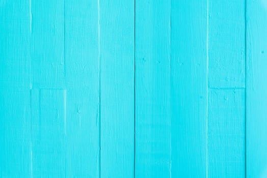 Pastel white and blue wooden table background texture.