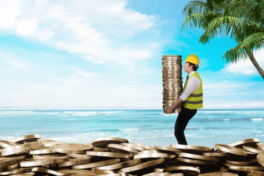 Side view of construction workers carrying coin stacks. Summer saving concept