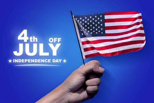 People hands holding american flag with blue background. Happy Independence Day