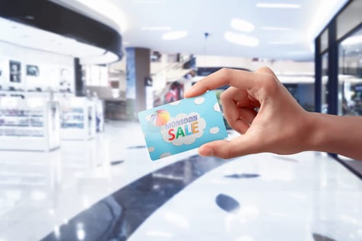 People hands holding monsoon sale card. Monsoon sale concept