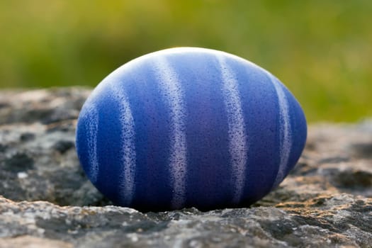 Nest of natural-colored Easter eggs in the garden