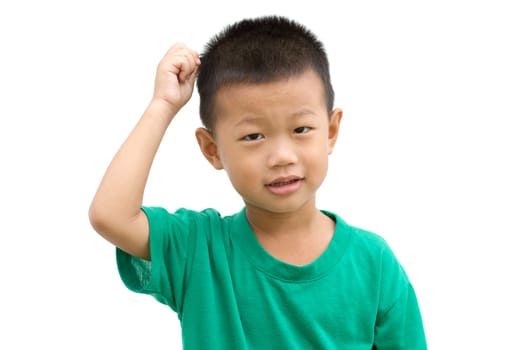 Happy Asian child pointing his hair and smiling. Portrait of young boy showing body parts isolated on white background.
