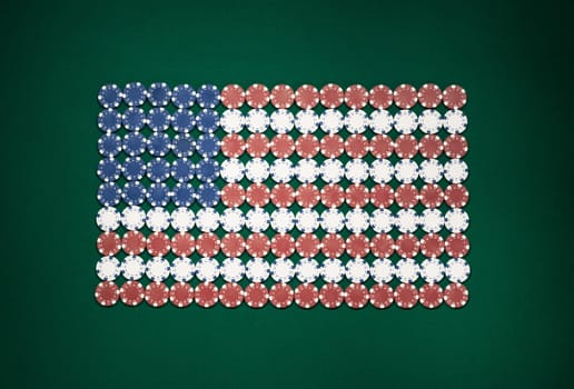 American flag composed of chips on a green table top view, casino and gambling concept
