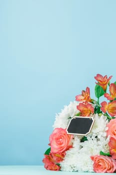 Love background with pink roses, flowers, gift, card on table. Concept of holiday Mother's Day. Copy space. Colorful studio background. holiday congratulations concept. Mother and love. Postcard
