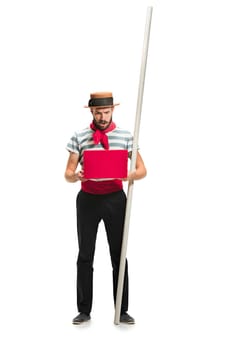 Caucasian funny bearded man in traditional gondolier costume and hat with paddle standing with mobile phone at studio isolated on white background. young man. Human emotions, facial expression concept
