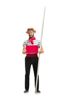 Caucasian funny bearded man in traditional gondolier costume and hat with paddle standing with mobile phone at studio isolated on white background. young man. Human emotions, facial expression concept