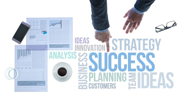 Businessman pointing at financial and business success concepts on white background desktop