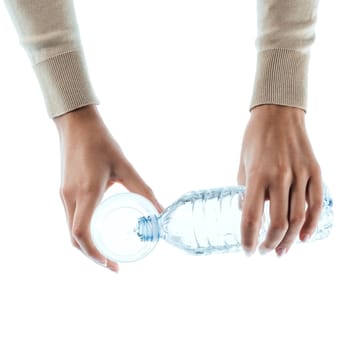 Young woman pouring fresh water in a glass on white background, hands close up, detox and hydration concept