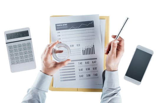 Businessman reading a financial report and holding a glass of water, hands close up, top view