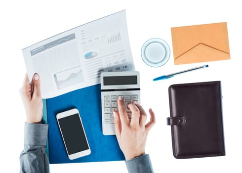 Business woman working at desk, checking a financial report and calculating balances on white background, top view