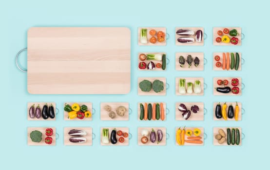 Fresh organic vegetables assortment on wooden chopping boards and copy space: healthy eating and vegan food concept