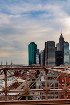 Brooklyn Bridge, New York, United States - June 08, 2015: Panoramic views from brooklyn bridge, skyscrapers and passing cars, the Manhattan skyline.