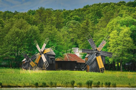 Windmills on the Bank of Lake in Romania