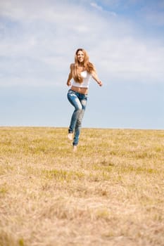 Happy girl on summer meadow
