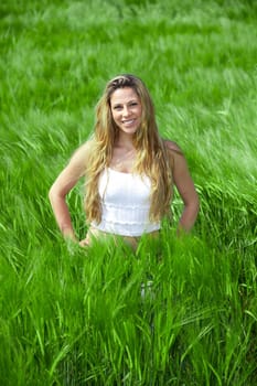 Happy girl on summer meadow