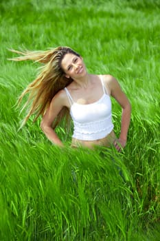 Happy girl on summer meadow