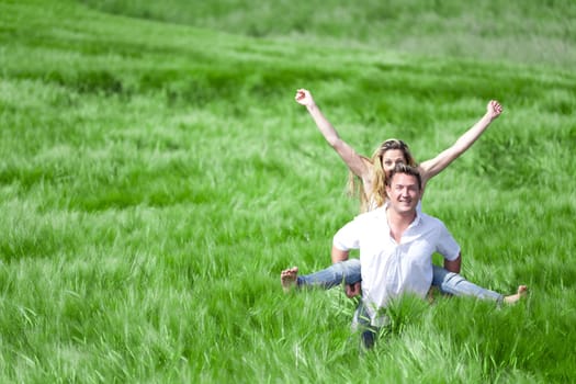 Happy People on summer Meadow