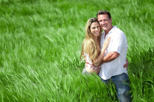 Happy People on summer Meadow
