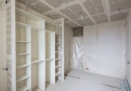 Interior of the renovated room with built-in wardrobe