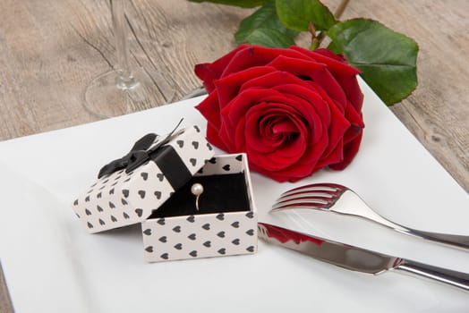 valentine day gift on a plate with red rose