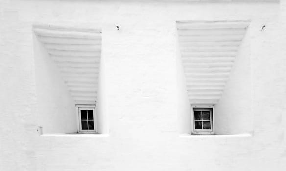 Small windows in an old building Novospassky Monastery in Moscow
