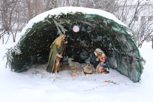 Biblical themes in the snow under fir branches