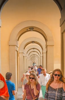 Florence, Italy, June 2015: a large number of tourists flock to the famous Vasari Corridor near the Uffizi museum in Florence