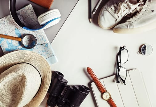 Traveler items. Vacation concept. Essential travel accessories. Vintage toned image. Top view. Flat lay