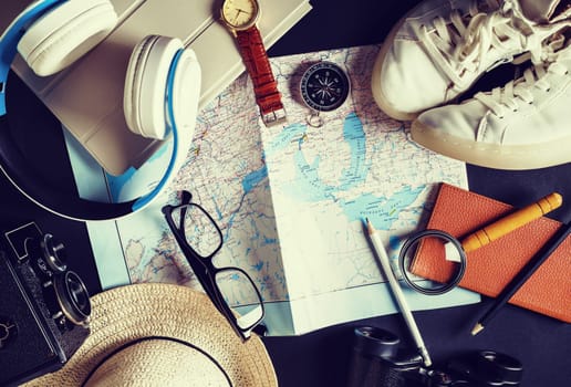 Overhead view of travel accessories and vacation items. Outfit of traveler. Vintage toned image. Top view. Flat lay.