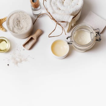 Spa and beauty threatment. Body care and cosmetic products on paper background. Space for text. Top view. Flat lay.