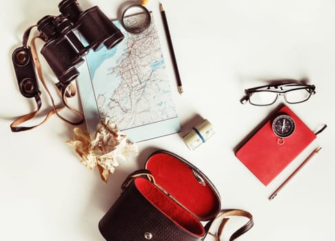 Photo of travel accessories. Top view of personal traveler's items. Vintage toned image. Top view. Flat lay.