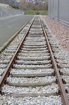 Rail Road Tracks Next to Warehouse Building
