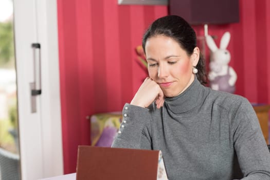 young woman at home using tablet pc