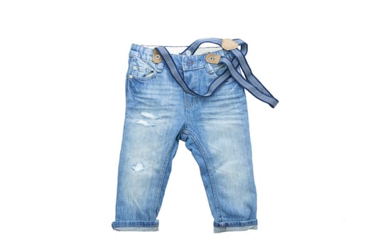 children clothes. Blue jeans with braces, suspenders