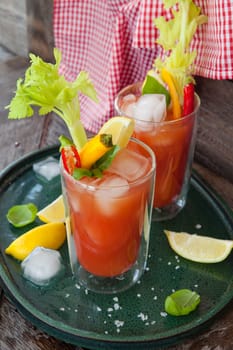 Colourful cocktail with tomato juice,garnished with vegetables