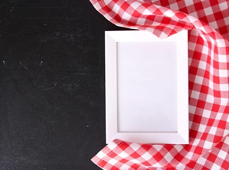 Red checkered cloth on blackboard,food recipe template concept.Empty menu frame.