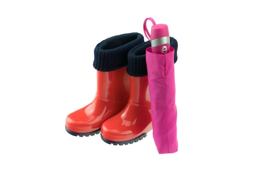 Red Rubber boots  and pink umbrella isolated on white backround. Concept kids shoes fashion.