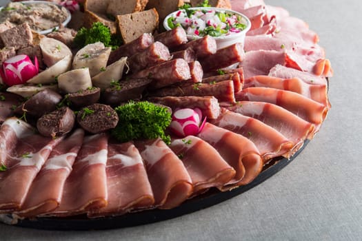 Assortment of meat delicatessen on a plate