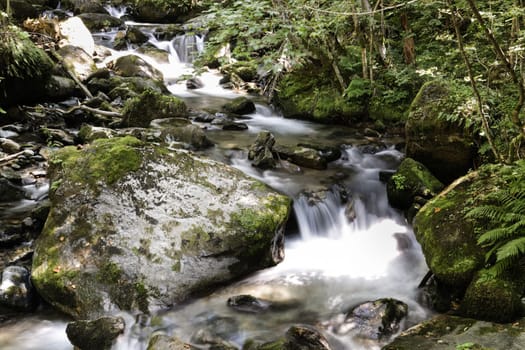 The soft water of a waterfall in the French Alps