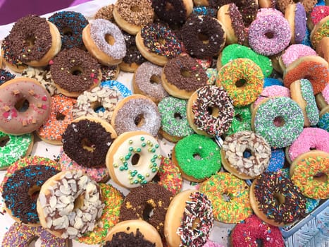 Set of assorted tasty donuts of different colors