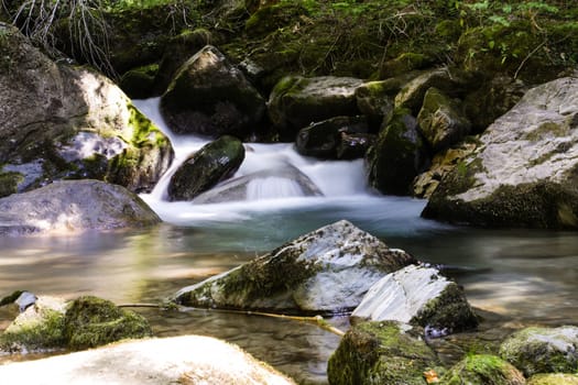 The soft water of a waterfall in the French Alps
