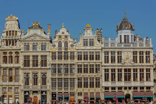 BRUSSELS, BELGIUM - SEPTEMBER 23, 2017: Tourists visiting the Grand Place in Brussels in Belgium during summer.