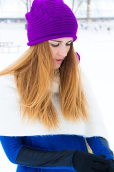Young girl playing in the snow