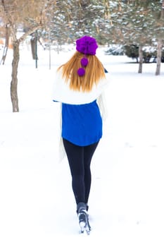 Young girl playing in the snow