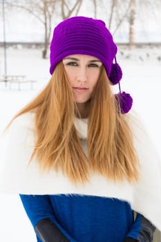 Young girl playing in the snow