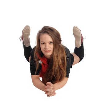 A beautiful young woman with long brunette hair and in sportswear.lying on her stomach on the floor, isolated for white background.