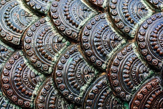 tiled snake scale skin thai architecture temple detail