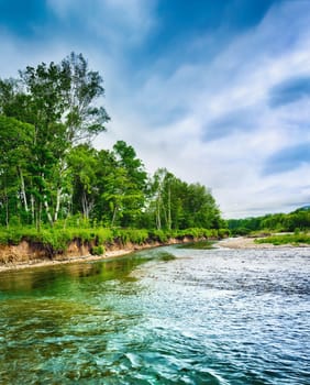 Beautiful russian landscape. Stream on the foreground.