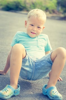 Cute doing exercises . Child outdoor activity