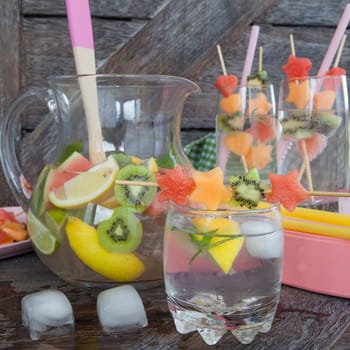 Fresh drinks with fresh fruit on skewers